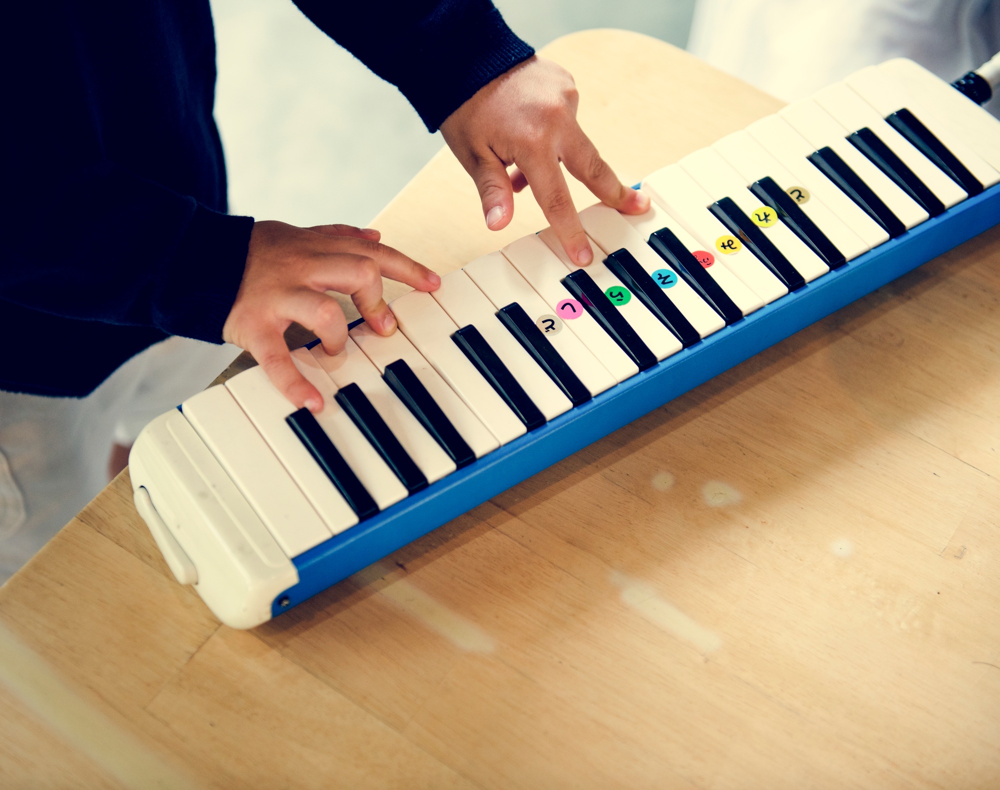 Boy playing piano music toy