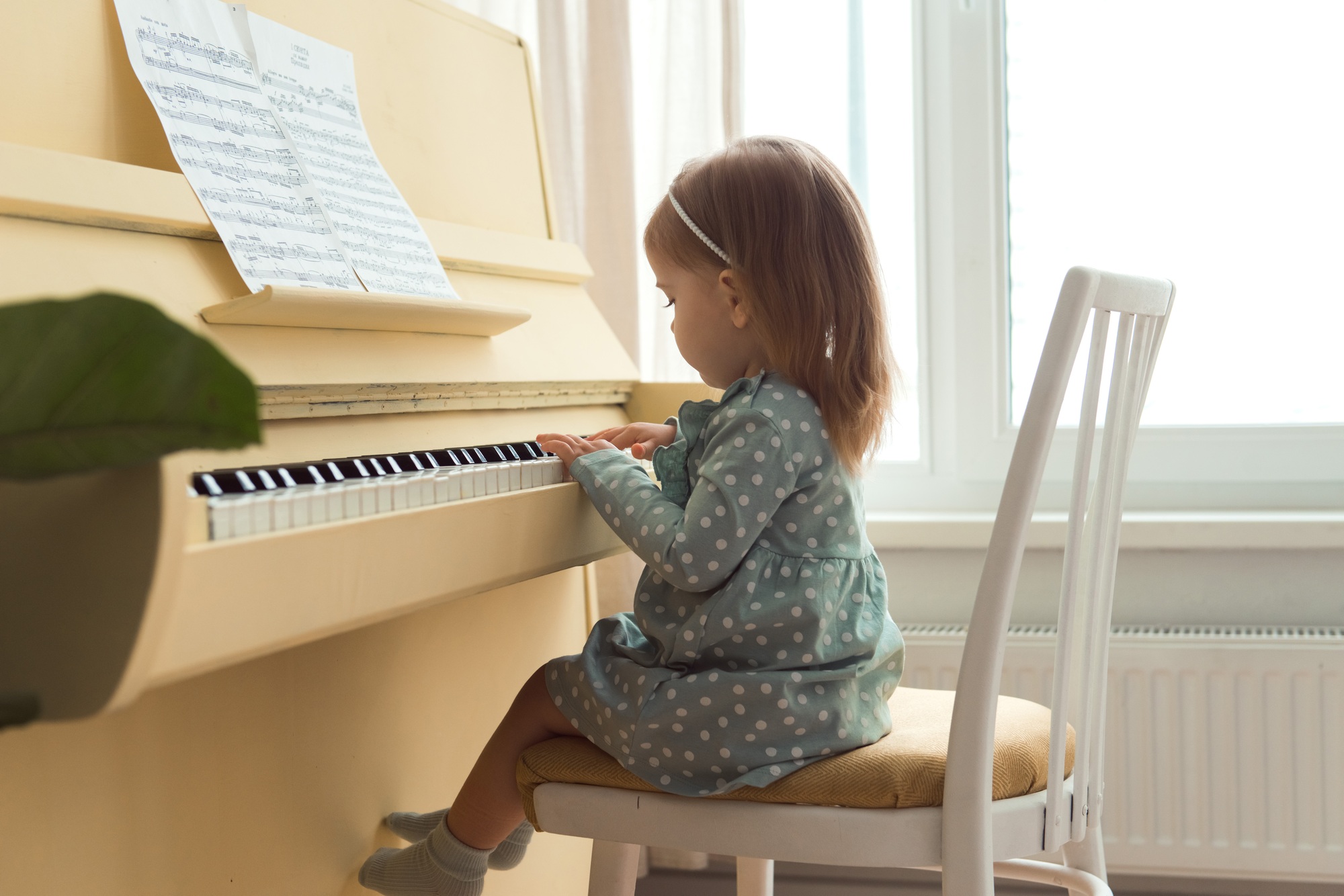 little girl playing piano