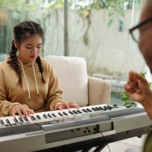 Gril Playing for Music Teacher