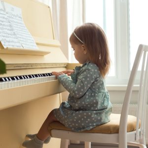 little girl playing piano